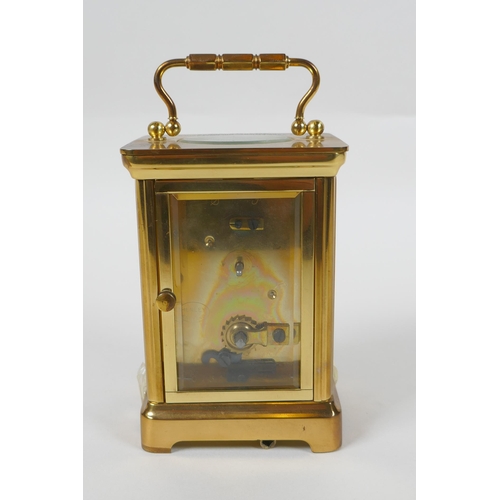 621 - A brass cased Henley carriage clock, retailed by Charles Greig, the dial with Roman numerals, 8 x 6c... 