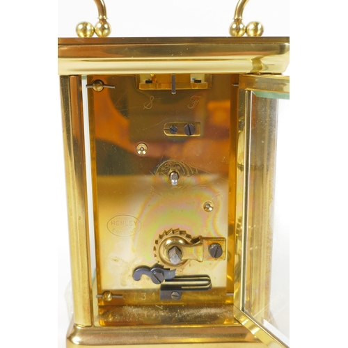 621 - A brass cased Henley carriage clock, retailed by Charles Greig, the dial with Roman numerals, 8 x 6c... 