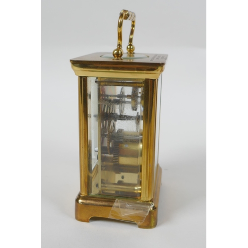 621 - A brass cased Henley carriage clock, retailed by Charles Greig, the dial with Roman numerals, 8 x 6c... 