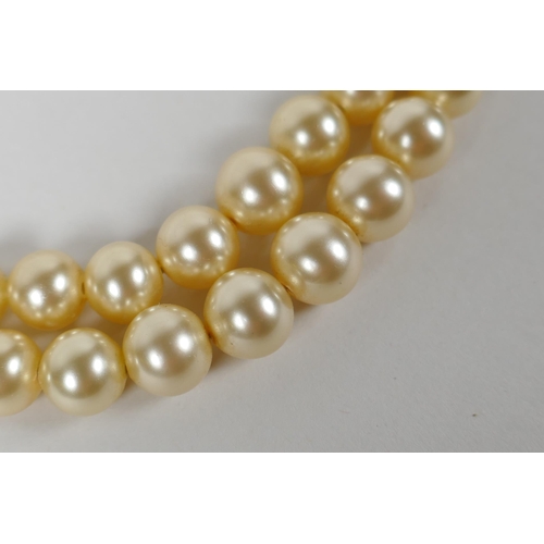 622 - A vintage graduated pearl twin strand necklace, 38cm long