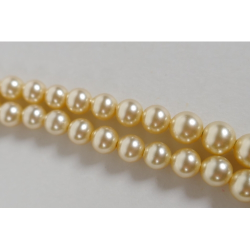 622 - A vintage graduated pearl twin strand necklace, 38cm long