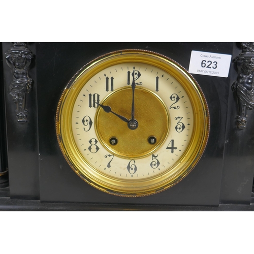 623 - A C19th slate mantel clock of classical form, with carved decoration to the pediment and brass dial ... 