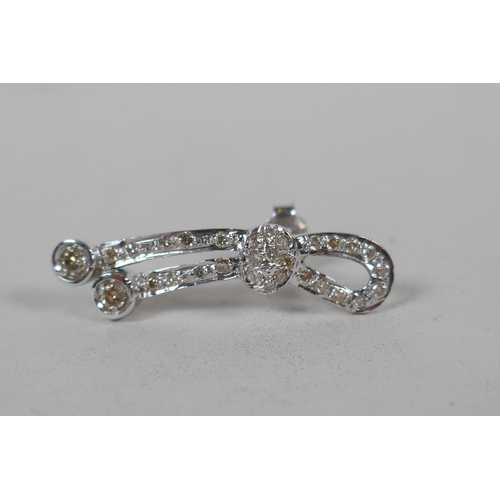 631 - A pair of Iranian white gold and diamond set earrings, indistinctly marked, gold untested, 5.3g gros... 