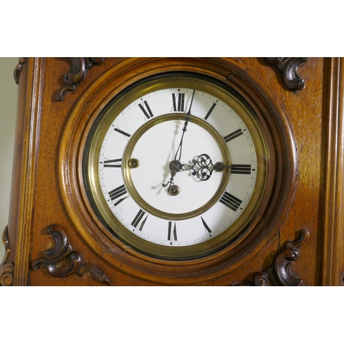 633 - A fine C19th Vienna wall clock in walnut case with carved and applied moulded detail, the brass and ... 