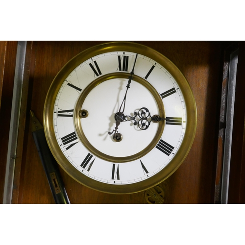 633 - A fine C19th Vienna wall clock in walnut case with carved and applied moulded detail, the brass and ... 