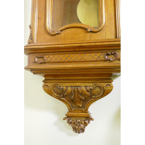 633 - A fine C19th Vienna wall clock in walnut case with carved and applied moulded detail, the brass and ... 