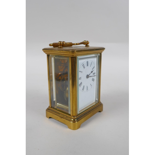 637 - A brass cased carriage clock, the enamel dial with Roman numerals, 8 x 6cm, 11cm high