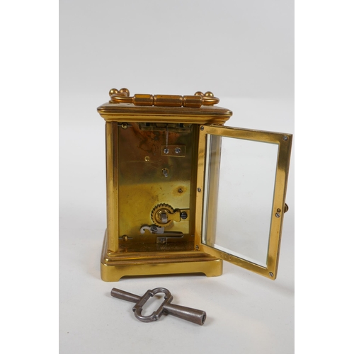 637 - A brass cased carriage clock, the enamel dial with Roman numerals, 8 x 6cm, 11cm high