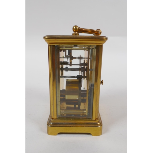 637 - A brass cased carriage clock, the enamel dial with Roman numerals, 8 x 6cm, 11cm high