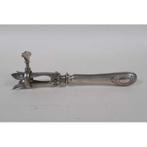 638 - An antique French silver handled lamb leg holder, together with and antique hallmarked silver handle... 