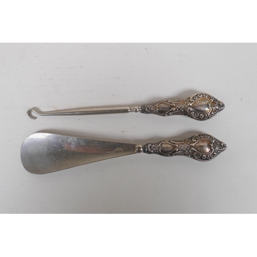 638 - An antique French silver handled lamb leg holder, together with and antique hallmarked silver handle... 