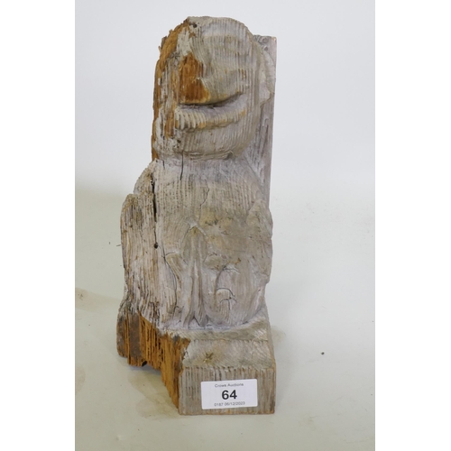 64 - An antique carved and weathered pine gargoyle term/mount, 26cm high