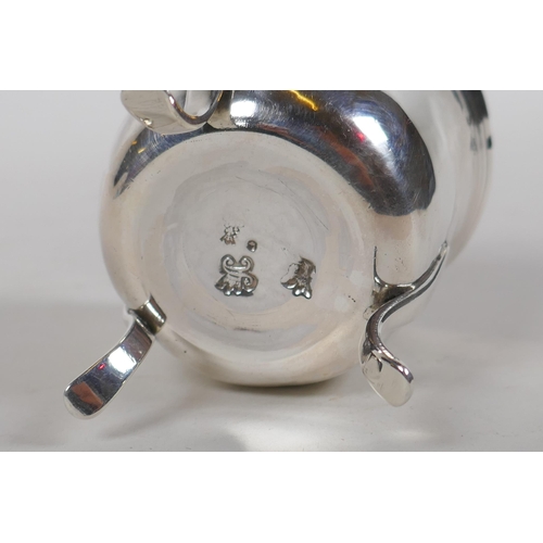 649 - An antique continental silver pot raised on tripod supports, 80.8g, probably French