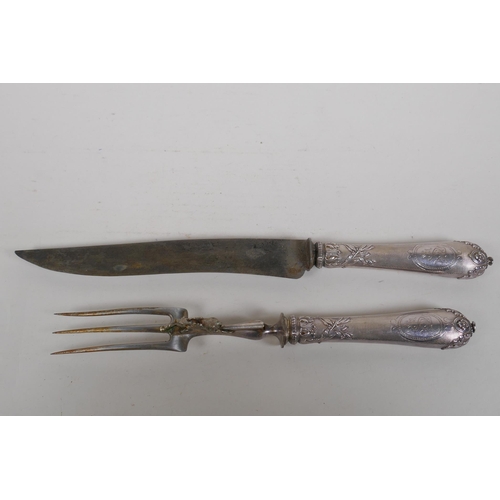 655 - A C19th French silver handled carving knife and fork set, with deer decoration, boxed, 33cm long