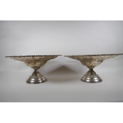 665 - A pair of Victorian Walker and Hall silver plated tazza, and a pair of silver plated fighting cocks,... 