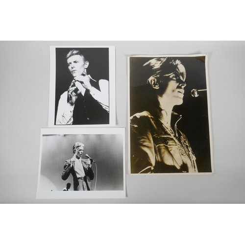 67 - Two 1970s black and white press photographs of David Bowie, with London Features International archi... 