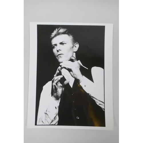 67 - Two 1970s black and white press photographs of David Bowie, with London Features International archi... 