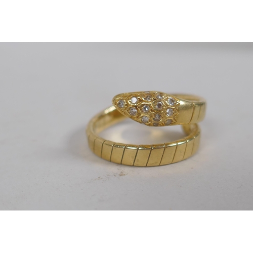 677 - An 18ct gold snake ring, the head and eyes set with diamonds, 7.3g approx size N