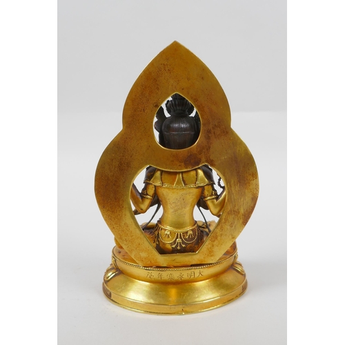 69 - A Sino Tibetan gilt bronze figure of Buddha, double vajra mark to base, 17cm high