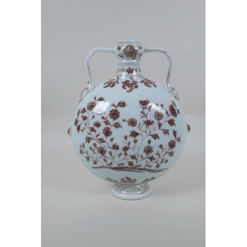 73 - A red and white porcelain two handled moon flask with floral decoration, Chinese Xuande 6 character ... 