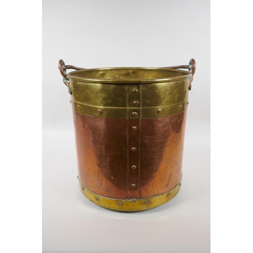 84 - An antique brass and copper riveted coal bucket, 33cm high x 31cm diameter