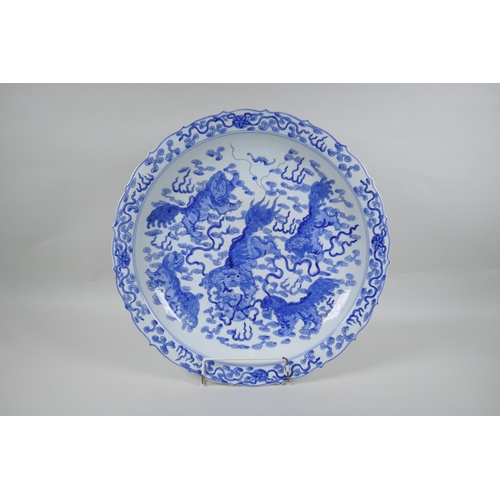 85 - A blue and white porcelain charger with lobed rim and kylin decoration, Chinese KangXi 6 character m... 