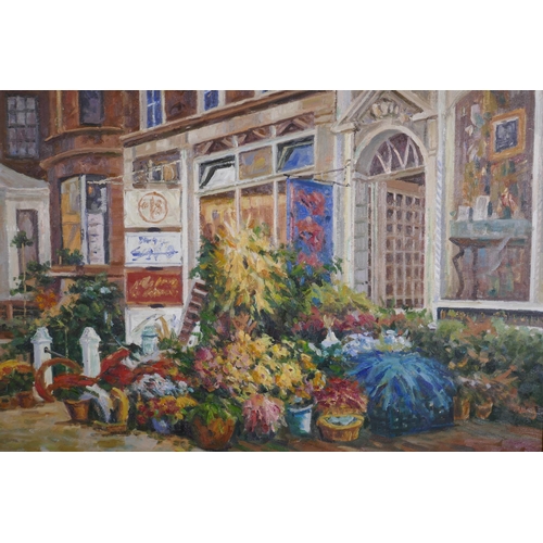 875 - Street scene with flower shop, signed Parker, late C20th, oil on canvas, 102 x 76cm