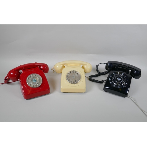 89 - Two vintage rotary dial telephones in red and cream, and a  push button telephone