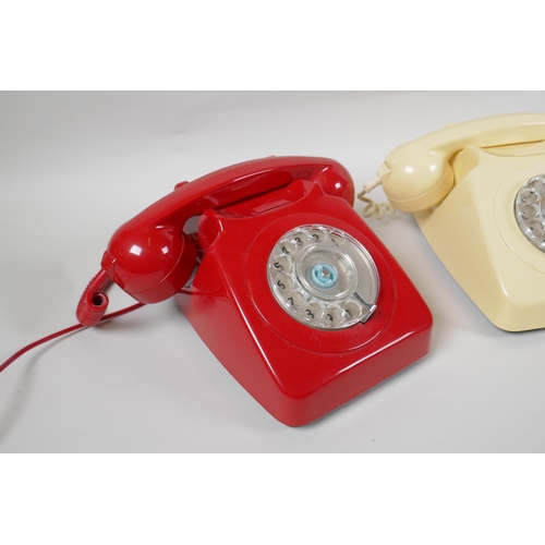 89 - Two vintage rotary dial telephones in red and cream, and a  push button telephone