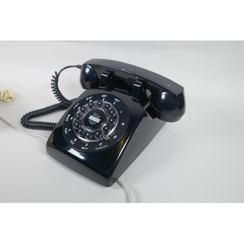 89 - Two vintage rotary dial telephones in red and cream, and a  push button telephone