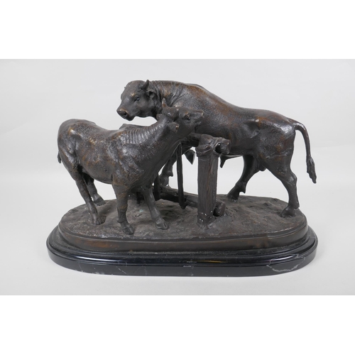 95 - After Pierre-Jules Mene, (French 1810-1879), bronzed metal figure of a cow and bull, on a marble sta... 