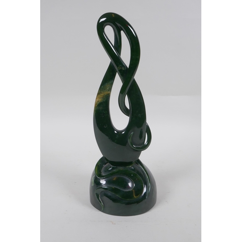 96 - A carved New Zealand spinach jade (Pounamu) abstract sculpture, 27cm high