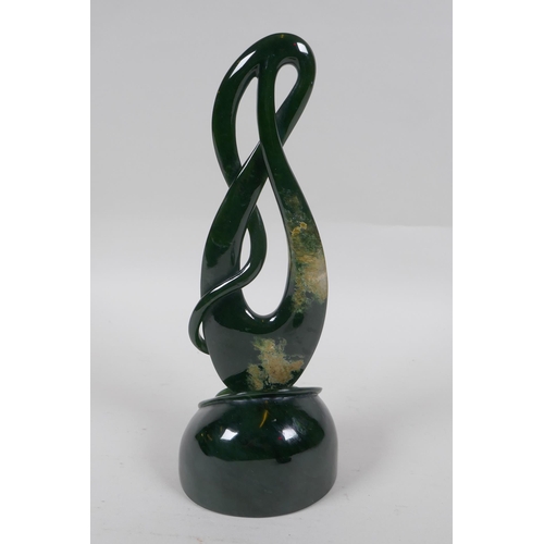 96 - A carved New Zealand spinach jade (Pounamu) abstract sculpture, 27cm high