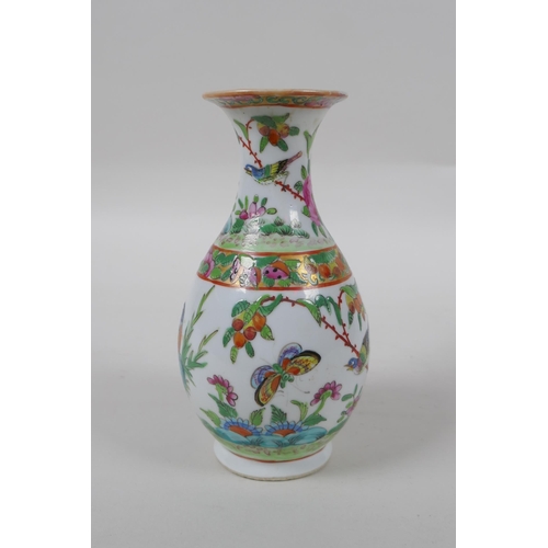 98 - A late C19th Cantonese famille vert porcelain vase decorated with birds and butterflies amongst flow... 