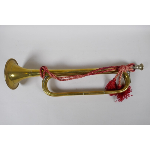 99 - A 1966 military brass bugle by Mayers and Harrison Ltd, marked with a broad arrow, a pair of Fred Ar... 