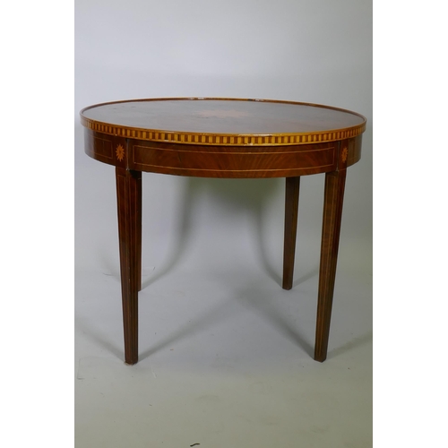 1086 - A marquetry inlaid figured mahogany centre table, with banded frieze top, raised on square tapering ... 