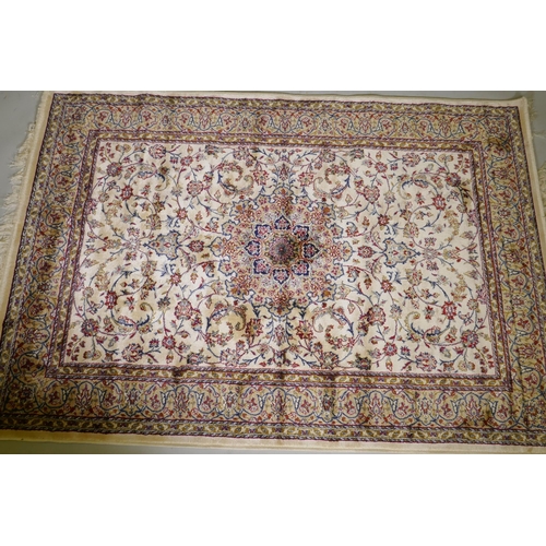 1122 - A Kashmiri ivory ground full pile rug with all over floral design, 117 x 170cm