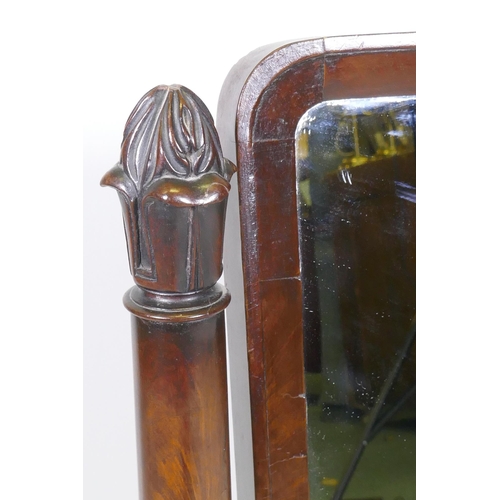 1097 - A C19th mahogany swing toilet mirror with tapering supports and original silvered glass, raised on p... 