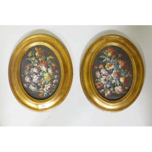 883 - A pair of still life, flowers, in the C18th style, unsigned, in oval gilt frames, C20th, oils on boa... 