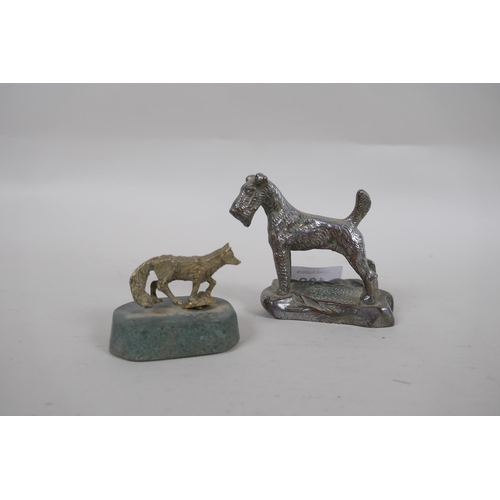 288 - A Desmo chrome metal car mascot in the form of an Airdale terrier, 7.5cm high, and a white metal fox... 