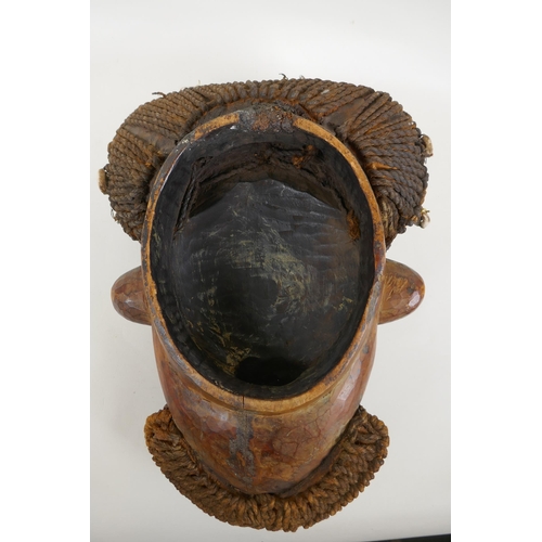 1 - A West African Bamileke wood mask, 28 x 36cm