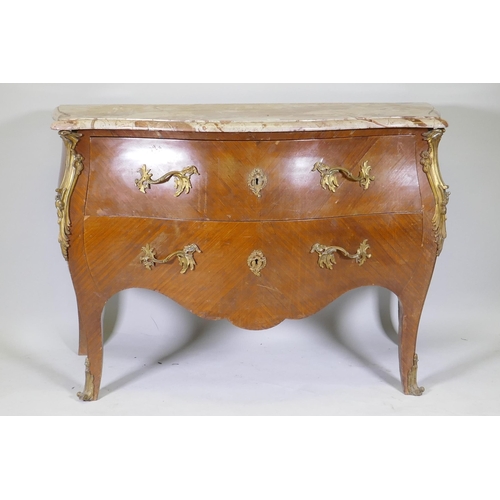 1001 - A French bombe shaped two drawer kingwood commode, with ormolu mounts and marble top, raised on swep... 