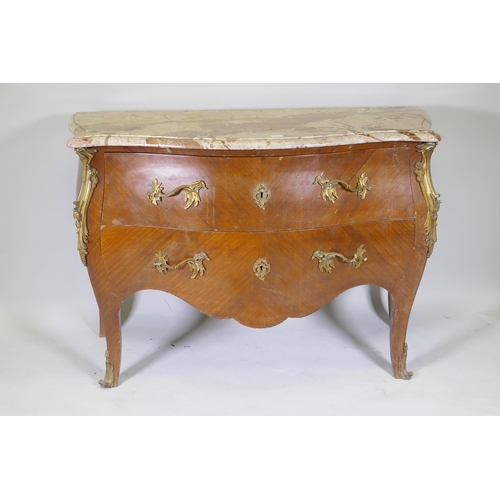 1001 - A French bombe shaped two drawer kingwood commode, with ormolu mounts and marble top, raised on swep... 