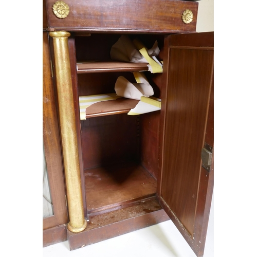 1003 - A Regency mahogany inverted breakfront side cabinet, with vert de mer marble top, three drawers over... 