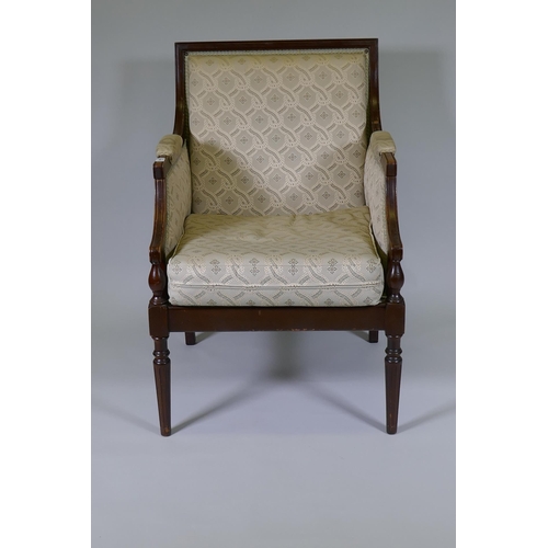 1006 - A French style walnut show frame armchair, raised on fluted turned supports, C20th