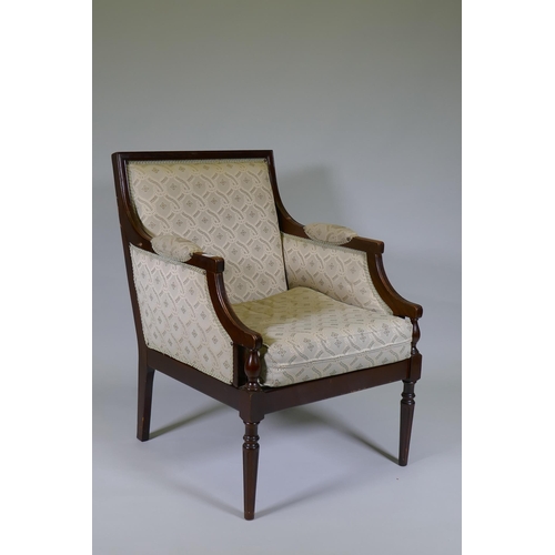 1006 - A French style walnut show frame armchair, raised on fluted turned supports, C20th