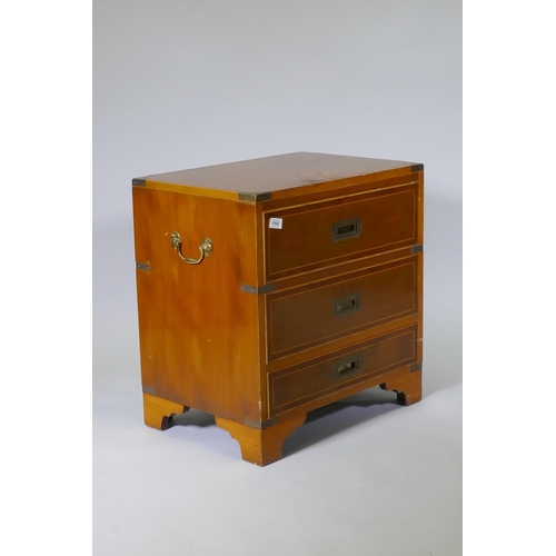 1008 - A campaign style inlaid yew wood veneered cellarette, with lift up top and fitted interior, two fals... 