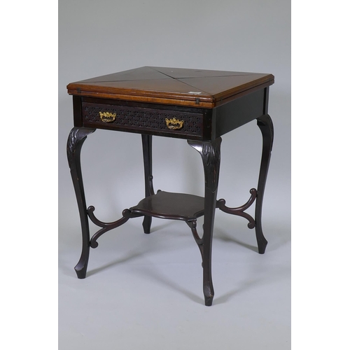 1010 - A Victorian mahogany envelope card table, the single drawer with blind fret decoration, raised on ca... 