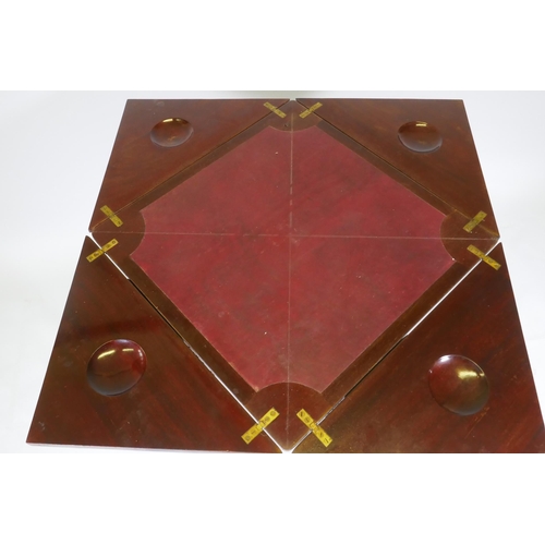 1010 - A Victorian mahogany envelope card table, the single drawer with blind fret decoration, raised on ca... 