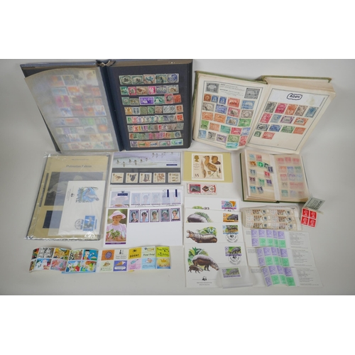 102 - A quantity of world stamps, First Day covers and complete and unused stamp books